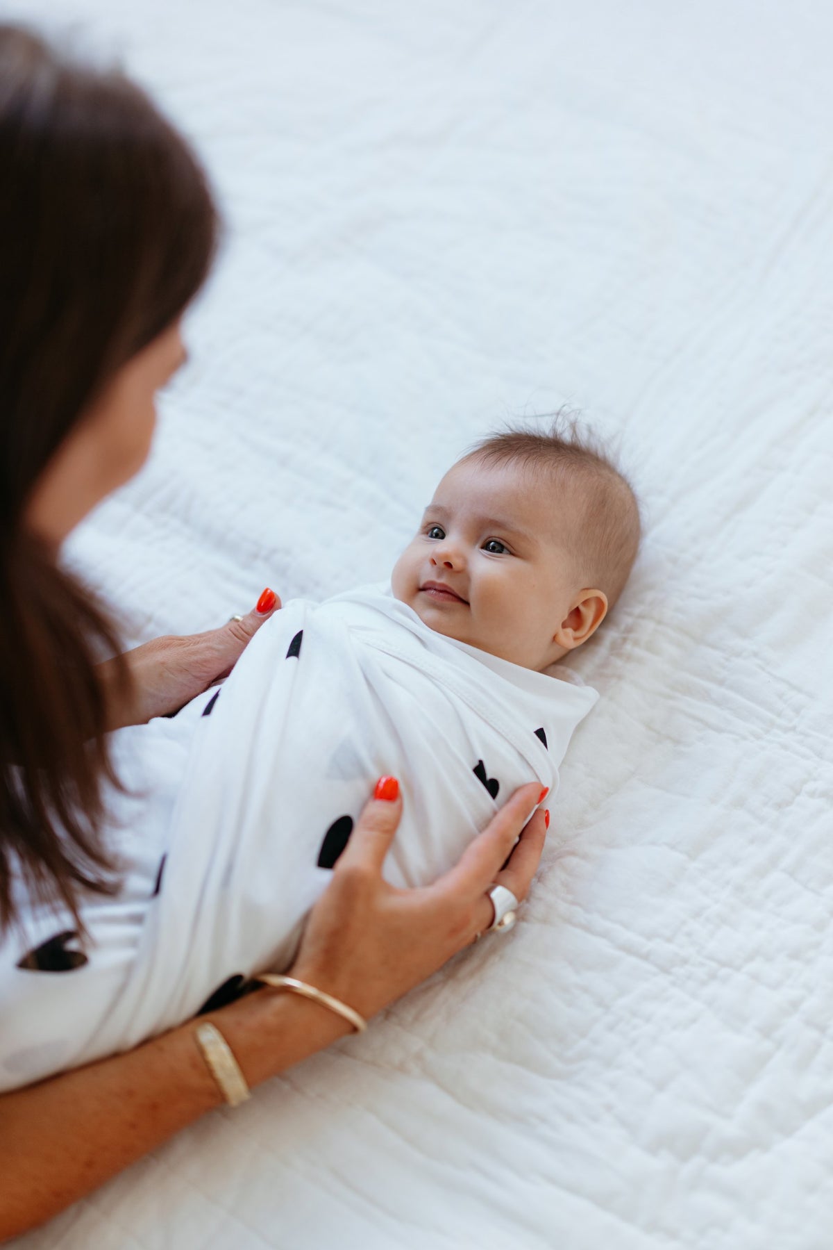 In-home consult shoot: mum and baby lying down