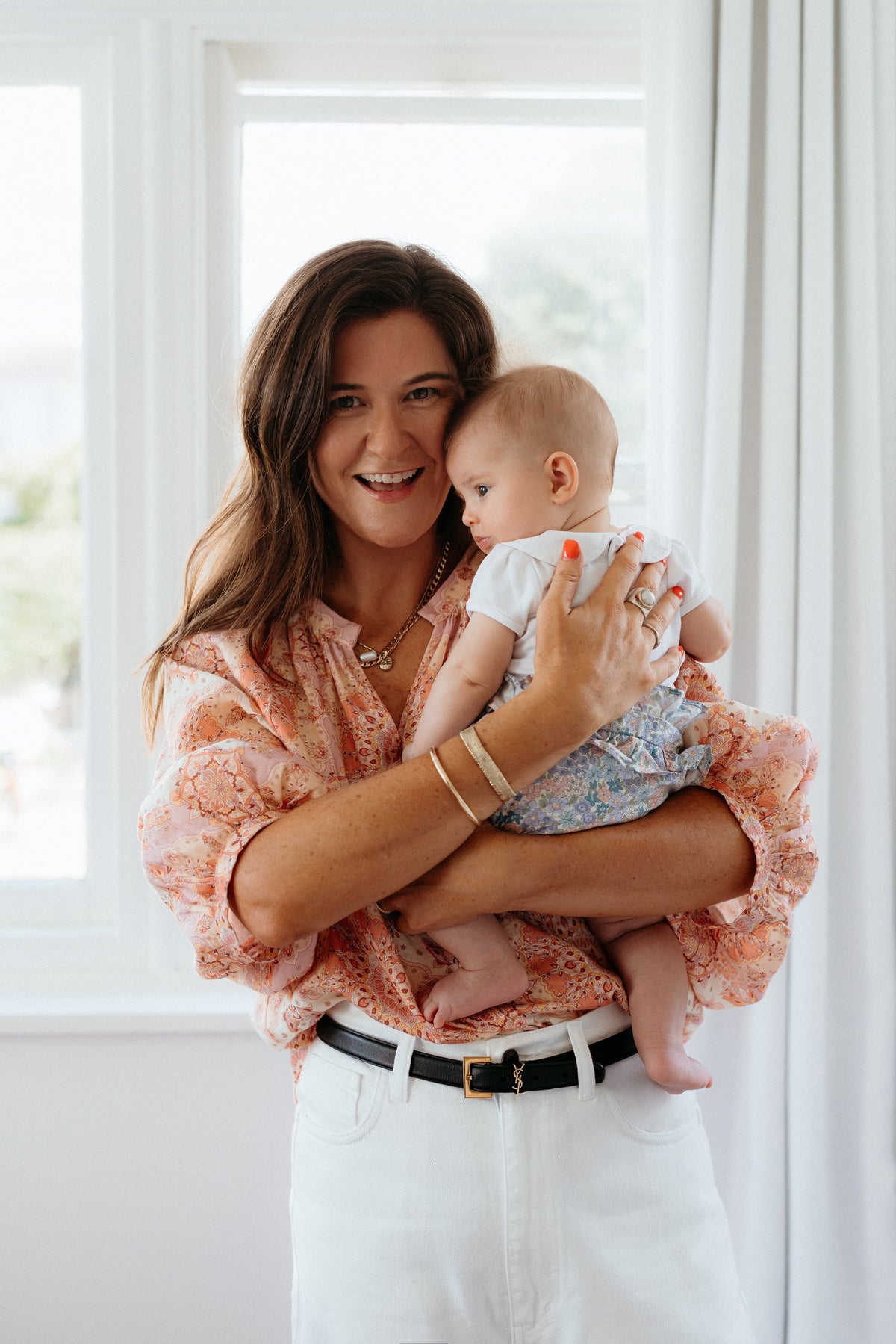 In-home consult shoot: mum holding baby window 02